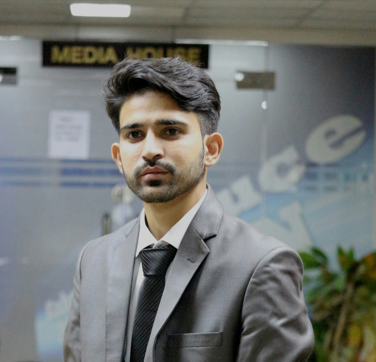 Replace before publishing: editorial stock portrait of a business strategist in a modern office
